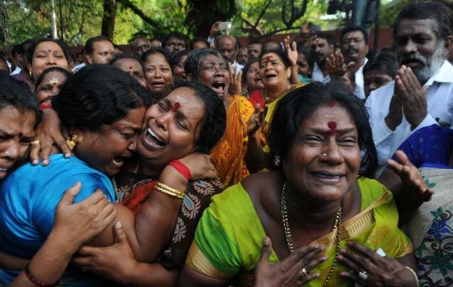 Jayalalithaa’s supporters react outside the hospital where she was being treated. (AFP Photo) Jayalalithaa’s supporters react outside the hospital where she was being treated. (AFP Photo)