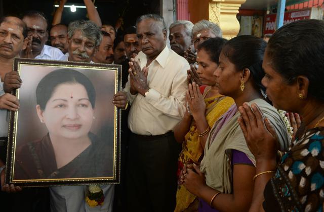 Supporters hold a photograph of Tamil Nadu state leader Jayalalithaa Jayaram as they offer prayers for her well being at a temple in Mumbai. (AFP File Photo) Supporters hold a photograph of Tamil Nadu state leader Jayalalithaa Jayaram as they offer prayers for her well being at a temple in Mumbai. (AFP File Photo)