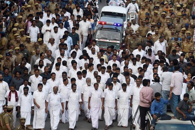 Tamil Nadu ministers and senior leaders at late chief minister J Jayalalithaa's funeral procession in Chennai on Tuesday. (PTI) Tamil Nadu ministers and senior leaders at late chief minister J Jayalalithaa's funeral procession in Chennai on Tuesday. (PTI)