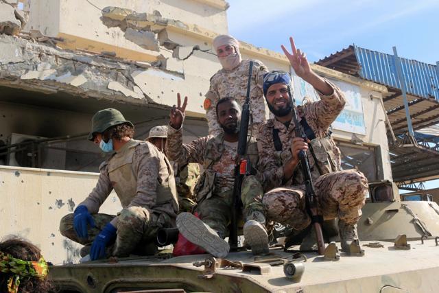 Fighters of Libyan forces allied with the U.N.-backed government celebrate after they finished clearing Ghiza Bahriya, the final district of the former Islamic State stronghold of Sirte. (REUTERS) Fighters of Libyan forces allied with the U.N.-backed government celebrate after they finished clearing Ghiza Bahriya, the final district of the former Islamic State stronghold of Sirte. (REUTERS)