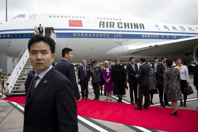 President of the People's Republic of China Xi Jinping and his wife Peng Liyuan greet dignitaries before boarding an Air China plane at Manchester airport in 2015. (Getty Images) President of the People's Republic of China Xi Jinping and his wife Peng Liyuan greet dignitaries before boarding an Air China plane at Manchester airport in 2015. (Getty Images)
