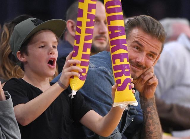 Cruz with his dad, former soccer player David Beckham. (AP) Cruz with his dad, former soccer player David Beckham. (AP)