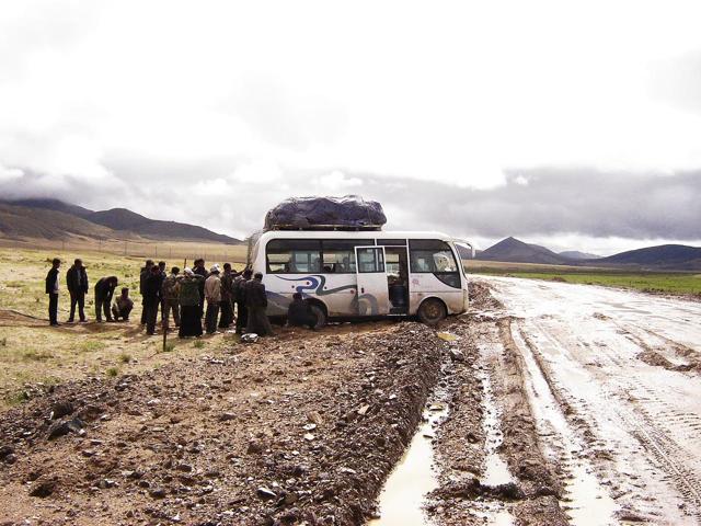 This ardous sacred trail often includes mishaps such as buses getting stuck in the mud This ardous sacred trail often includes mishaps such as buses getting stuck in the mud