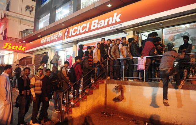 Residents queue in a line to withdraw money from an ATM in Allahabad. (AFP Photo) Residents queue in a line to withdraw money from an ATM in Allahabad. (AFP Photo)
