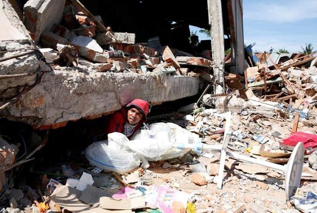 A man retrieves fans from a collapsed shop following a strong earthquake in Meureudu, Pidie Jaya, Aceh province, Indonesia. (Reuters) A man retrieves fans from a collapsed shop following a strong earthquake in Meureudu, Pidie Jaya, Aceh province, Indonesia. (Reuters)