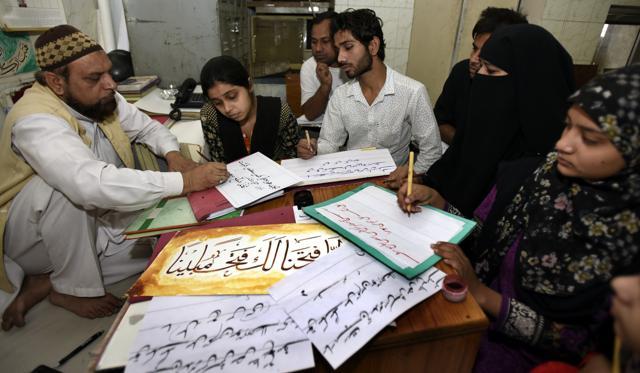 Urdu teacher Waseem Ahmad training students at Urdu Academy in Kashmiri Gate in New Delhi. (Sonu Mehta/HT Photo) Urdu teacher Waseem Ahmad training students at Urdu Academy in Kashmiri Gate in New Delhi. (Sonu Mehta/HT Photo)