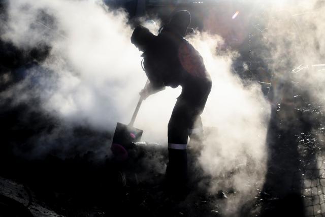 Firefighters work at the site where a freight train transporting highly-flammable gas derailed and exploded in the northeastern Bulgarian village of Hitrino, killing seven and injuring dozens more. (AFP Photo) Firefighters work at the site where a freight train transporting highly-flammable gas derailed and exploded in the northeastern Bulgarian village of Hitrino, killing seven and injuring dozens more. (AFP Photo)