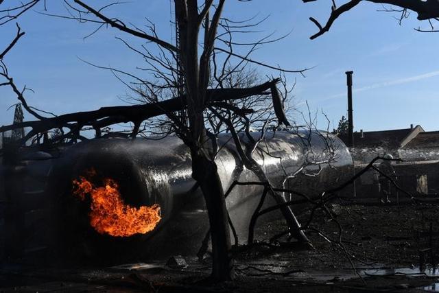 Firefighters work on the site where a cargo train derailed and exploded in the village of Hitrino, Bulgaria. (Reuters) Firefighters work on the site where a cargo train derailed and exploded in the village of Hitrino, Bulgaria. (Reuters)