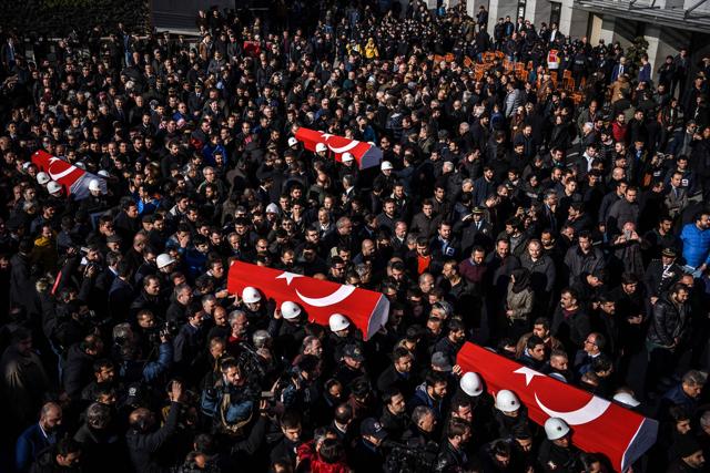 People carry the coffins of Turkish police officers during a funeral ceremomy at Istanbul's police headquarters on Sunday. (AFP) People carry the coffins of Turkish police officers during a funeral ceremomy at Istanbul's police headquarters on Sunday. (AFP)