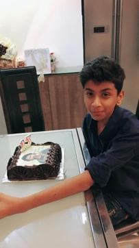 Aryan, a Prabhas fan, with his special birthday cake. Aryan, a Prabhas fan, with his special birthday cake.
