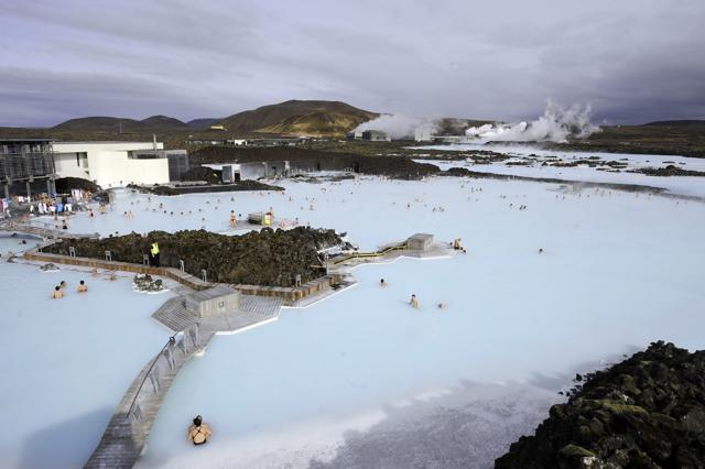 Tourists stand in the Blue Lagoon outside Reykjavik. (AFP)