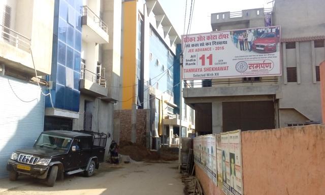 A advertisement poster of Tanmaya’s coaching institute hangs from a house in Sikar . (HT Photo) A advertisement poster of Tanmaya’s coaching institute hangs from a house in Sikar . (HT Photo)
