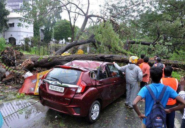 A tree falls over a car in Chennai after Vardah made a landfall on Monday. (Vanne Srinivasulu / HT Photo) A tree falls over a car in Chennai after Vardah made a landfall on Monday. (Vanne Srinivasulu / HT Photo)