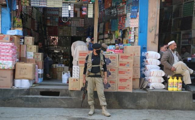 A policeman stands guard at a market in Mingora, in Swat Valley, Pakistan. (REUTERS) A policeman stands guard at a market in Mingora, in Swat Valley, Pakistan. (REUTERS)
