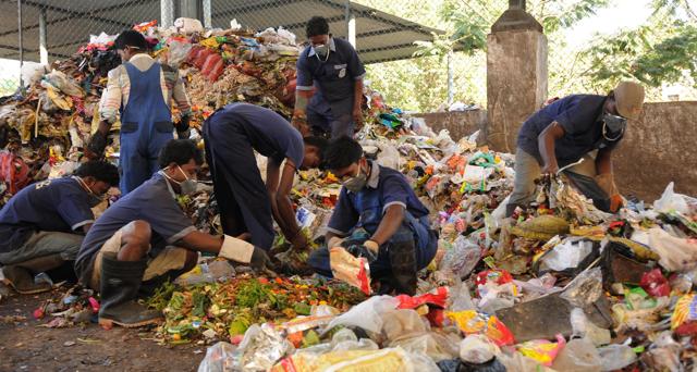 Rag-pickers segregate waste at the plant. The bio-degradable waste goes to the compost where it is turned into manure. (Subhankar Chakraborty/HT PHOTO) Rag-pickers segregate waste at the plant. The bio-degradable waste goes to the compost where it is turned into manure. (Subhankar Chakraborty/HT PHOTO)
