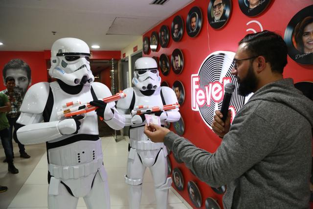 The Stormtroopers interact with RJ Addy during the visit at HT House