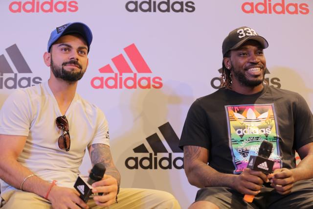 Virat Kohli and Chris Gayle at a promotional event. (HT Photo)