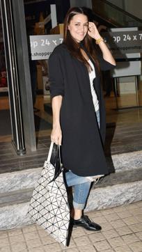 Neha Dhupia looks absolutely casual and chic in ripped jeans paired with a black coat and matching brogues. (Yogen Shah) Neha Dhupia looks absolutely casual and chic in ripped jeans paired with a black coat and matching brogues. (Yogen Shah)