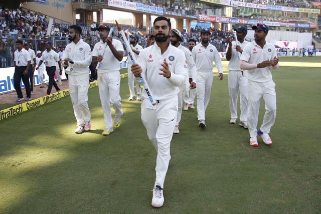 India celebrate the win over England during day 5 of the fourth Test against England held at the Wankhede Stadium, Mumbai on December 12. Virat Kohli was the Man of the Match. (BCCI )