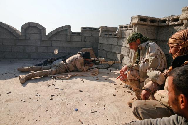 A member of the Iraqi Army shoots during clashes with Islamic State militants at the south of Mosul, Iraq. (REUTERS) A member of the Iraqi Army shoots during clashes with Islamic State militants at the south of Mosul, Iraq. (REUTERS)