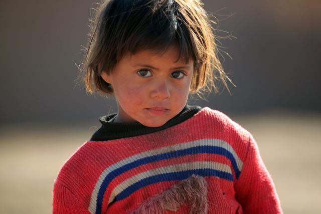 A displaced Iraqi child, from the outskirts of the city of Tal Afar, poses at a makeshift camp on December 12, 2016 in the village of Khalif Saleh, south of Tal Afar, where his families found refuge as Iraqi forces continue their assault to eject Islamic State (IS) group jihadists from Mosul, their last Iraqi stronghold. (AFP Photo) A displaced Iraqi child, from the outskirts of the city of Tal Afar, poses at a makeshift camp on December 12, 2016 in the village of Khalif Saleh, south of Tal Afar, where his families found refuge as Iraqi forces continue their assault to eject Islamic State (IS) group jihadists from Mosul, their last Iraqi stronghold. (AFP Photo)