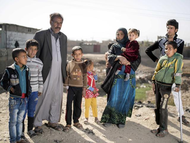Khodr Ahmed and his wife Khodriya Ahmed stand with their children after escaping fighting in Mosul in this Nov. 12, 2016 photo taken in Gogjali, Iraq. (AP) Khodr Ahmed and his wife Khodriya Ahmed stand with their children after escaping fighting in Mosul in this Nov. 12, 2016 photo taken in Gogjali, Iraq. (AP)