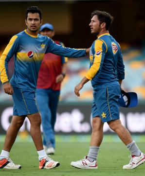 Pakistan player Mohammad Nawaz (left) calms down Yasir Shah after his spat with paceman Wahab Riaz during a training session at The Gabba in Brisbane on Wednesday. (AFP)