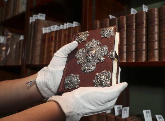 A copy of The Tales of Beedle the Bard, handwritten and illustrated by Harry Potter author JK Rowling, is displayed at Sotheby's auction house in London. (REUTERS) A copy of The Tales of Beedle the Bard, handwritten and illustrated by Harry Potter author JK Rowling, is displayed at Sotheby's auction house in London. (REUTERS)