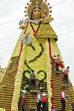 The 45-foot wooden statue of Our Lady of the Forsaken which is dressed up with flowers on the day of La Ofrenda The 45-foot wooden statue of Our Lady of the Forsaken which is dressed up with flowers on the day of La Ofrenda