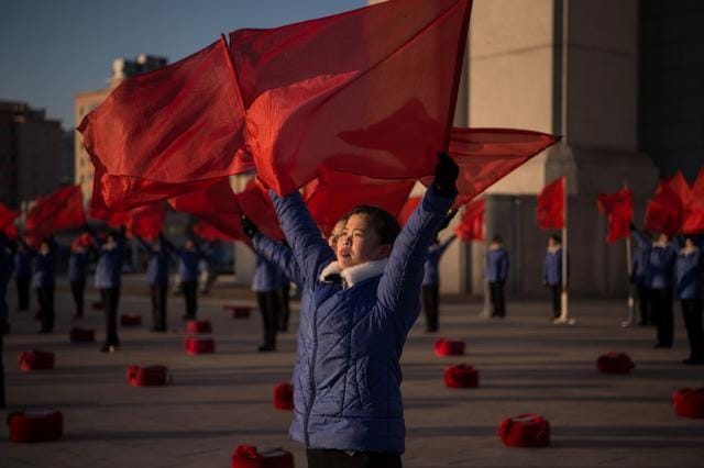 A propaganda troupe perform before the Arch of Triumph on the last day of the 200-day campaign in Pyongyang on December 15. (AFP Photo) A propaganda troupe perform before the Arch of Triumph on the last day of the 200-day campaign in Pyongyang on December 15. (AFP Photo)