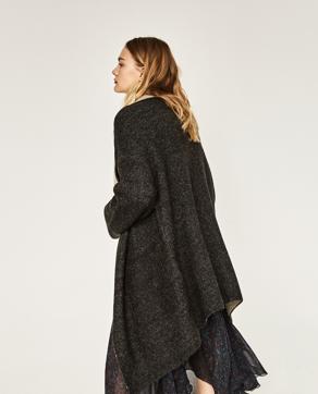“Layer short or knee-length dresses and skirts with oversized jackets and long flowy capes for a stylish wintery look,” says designer Sonam Modi. (Zara)
