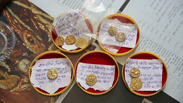 The gold coins reportedly found by villagers in a mine, recovered by the police officials at Malpura in Tonk. (Himanshu Vyas/HT) The gold coins reportedly found by villagers in a mine, recovered by the police officials at Malpura in Tonk. (Himanshu Vyas/HT)