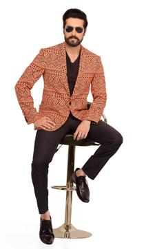 For men, fitted cotton or silk blazers in ethnic prints are in, says designer Surbhi Pansari. (Surbhi Pansari )