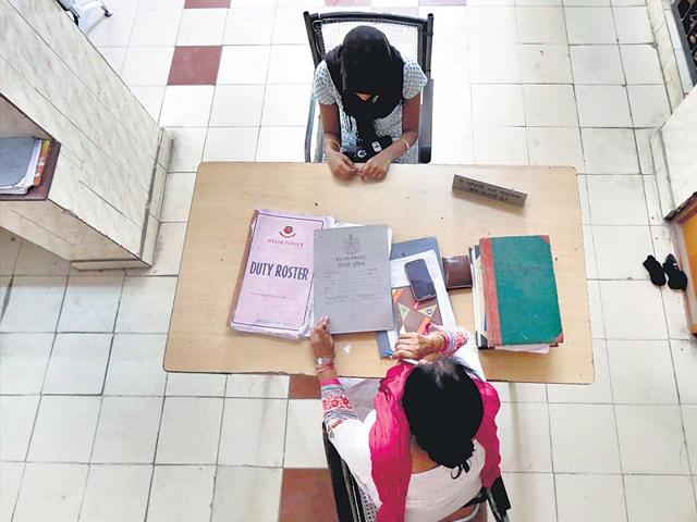 A-sub-inspector-records-the-statement-of-a-woman-complainant-at-a-police-station-in-Delhi-Ravi-Choudhary-HT-Photo A-sub-inspector-records-the-statement-of-a-woman-complainant-at-a-police-station-in-Delhi-Ravi-Choudhary-HT-Photo