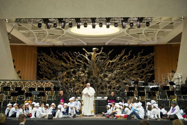 Children sit with people dressed as clowns on the stage near Pope Francis during a special audience with patients and employees of the Vatican-owned pediatric hospital of Bambino Gesu, in the Paul VI hall, at the Vatican on Dec 15. (AP Photo) Children sit with people dressed as clowns on the stage near Pope Francis during a special audience with patients and employees of the Vatican-owned pediatric hospital of Bambino Gesu, in the Paul VI hall, at the Vatican on Dec 15. (AP Photo)