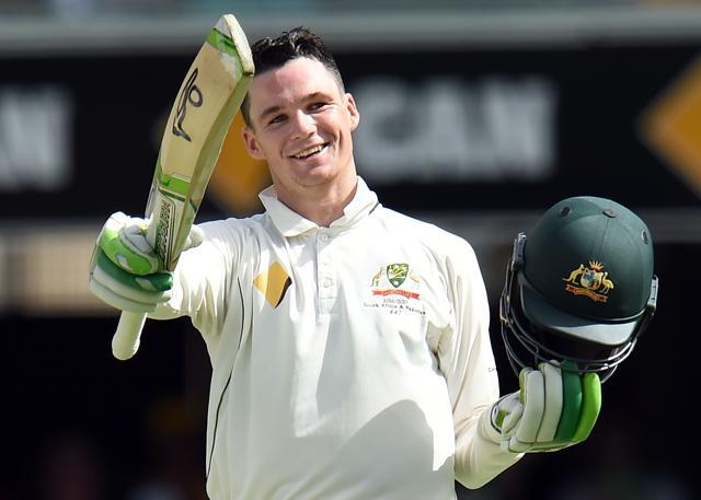 Australia's batsman Peter Handscomb celebrates his century during the second day-night cricket Test between Australia and Pakistan in Brisbane. (AFP)