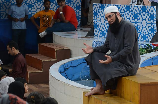 Singer-turned-peracher Junaid Jamshed (R) presents an Islamic quiz show Shan-e-Ramadan in Karachi. Jamshed was among 47 people killed in a plane crash on December 8. (AFP) Singer-turned-peracher Junaid Jamshed (R) presents an Islamic quiz show Shan-e-Ramadan in Karachi. Jamshed was among 47 people killed in a plane crash on December 8. (AFP)