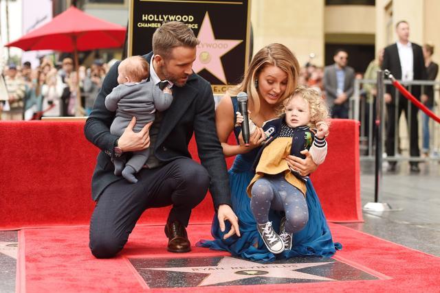Ryan Reynolds and Blake Lively pose with their daughters as he is honoured with star on the Hollywood Walk of Fame on December 15, 2016 in Hollywood, California. (AFP)