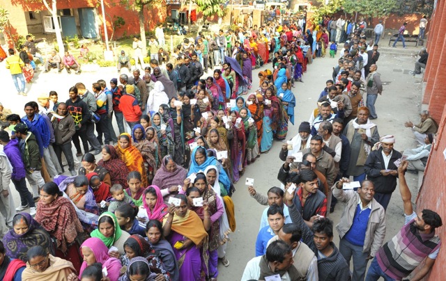 Voters in queue outside polling booth at CTU Workshop Industrial Area Phase 1 in Chandigarh on Sunday. (Keshav Singh/HT Photo)