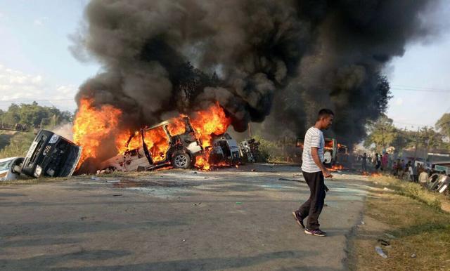 Vehicles are seen burning after being set alight by protesters in Imphal, the capital of Manipur. (AFP) Vehicles are seen burning after being set alight by protesters in Imphal, the capital of Manipur. (AFP)