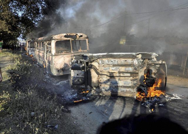 Vehicles are seen burning after being set alight by protesters in Imphal, the capital of Manipur. (PTI) Vehicles are seen burning after being set alight by protesters in Imphal, the capital of Manipur. (PTI)