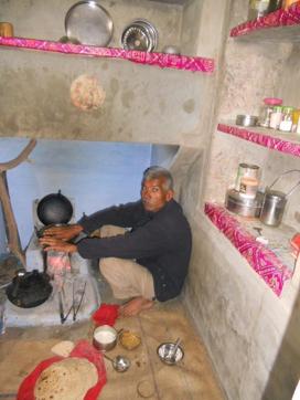 Ram Chandra’s father sits in the kitchen of their house built using the scholarship money. (HT Photo)