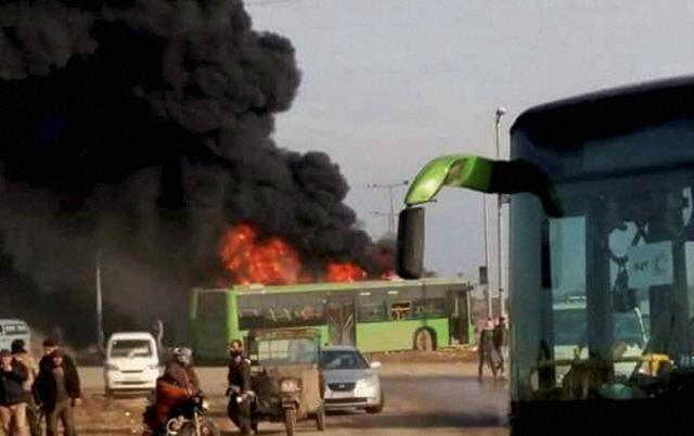 Militants burned at least five buses assigned to evacuate wounded and sick people from two villages in northern Syria on Sunday. (AP photo)