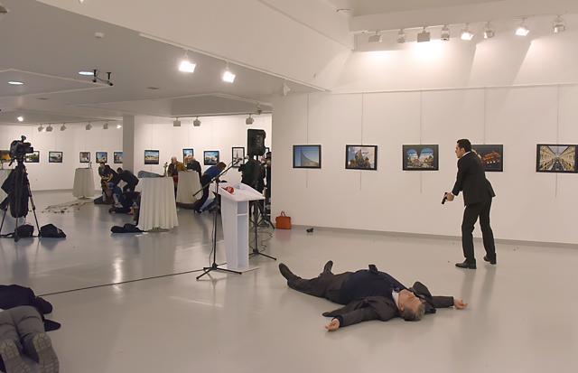 This picture taken shows Andrey Karlov (2ndR), the Russian ambassador to Ankara, lying on the floor after being shot. (AFP) This picture taken shows Andrey Karlov (2ndR), the Russian ambassador to Ankara, lying on the floor after being shot. (AFP)