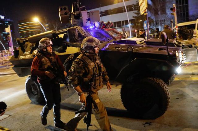 Turkish police secure the area near an art gallery where the Russian Ambassador to Turkey was fatally shot. (REUTERS) Turkish police secure the area near an art gallery where the Russian Ambassador to Turkey was fatally shot. (REUTERS)