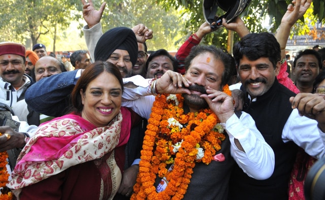 ongress candidate Devinder Singh Babla in jubilant mood after winning MC election at Sector 26 in Chandigarh on Tuesday. (Anil Dayal/HT Photo) ongress candidate Devinder Singh Babla in jubilant mood after winning MC election at Sector 26 in Chandigarh on Tuesday. (Anil Dayal/HT Photo)