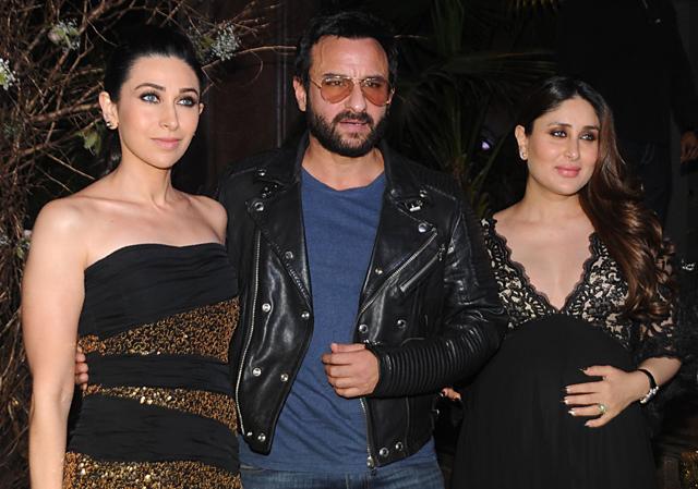 Kareena poses for shutterbugs with sister Karisma Kapoor and husband Saif Ali Khan. (AFP)