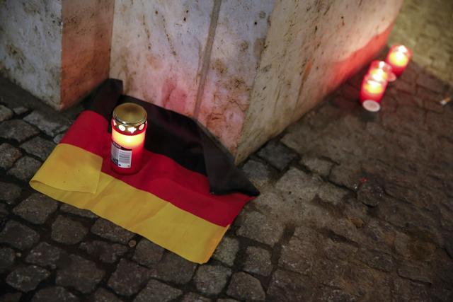 A candle is burning on a German national flag near the site where a truck ploughed through a crowd at a Berlin Christmas market on Breitscheidplatz square near the fashionable Kurfuerstendamm avenue in the west of Berlin, Germany, December 20, 2016 REUTERS (REUTERS Photo) A candle is burning on a German national flag near the site where a truck ploughed through a crowd at a Berlin Christmas market on Breitscheidplatz square near the fashionable Kurfuerstendamm avenue in the west of Berlin, Germany, December 20, 2016 REUTERS (REUTERS Photo)