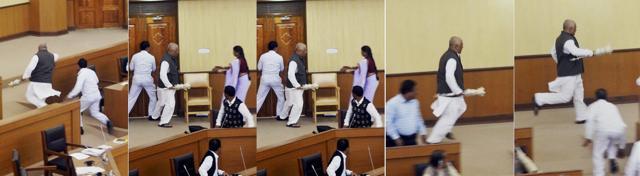 Trinamool Congress MLA Sudip Roy Barman runs away with Assembly Speaker Ramendra Chandra Debnath’s ceremonial mace during a protest on assembly session in Agartala, Tripura on Monday. (PTI) Trinamool Congress MLA Sudip Roy Barman runs away with Assembly Speaker Ramendra Chandra Debnath’s ceremonial mace during a protest on assembly session in Agartala, Tripura on Monday. (PTI)
