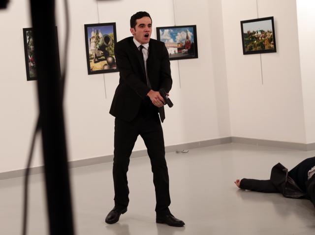 The gunman was identified by the Turkish interior minister as 22-year-old Mevlut Mert Altintas, who had worked in the Ankara anti-riot police for the last two-and-a-half years. It was not known if he was on duty in the exhibition hall at the time and if not, how he managed to gain access carrying a weapon. (AP) The gunman was identified by the Turkish interior minister as 22-year-old Mevlut Mert Altintas, who had worked in the Ankara anti-riot police for the last two-and-a-half years. It was not known if he was on duty in the exhibition hall at the time and if not, how he managed to gain access carrying a weapon. (AP)